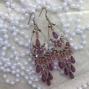 Yellow 💛gold earrings with a 💜purple diamonds